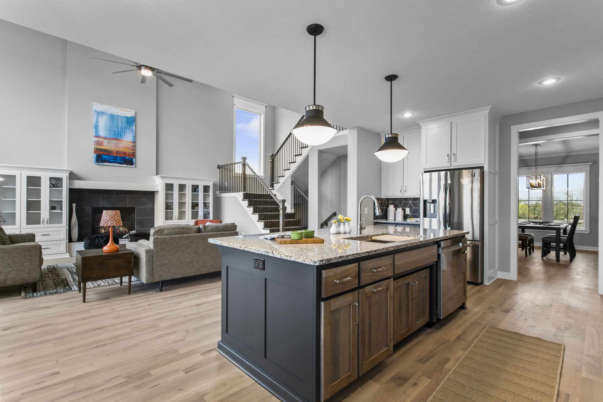 The Jefferson 1.5-story floor plan kitchen opens to the great room.