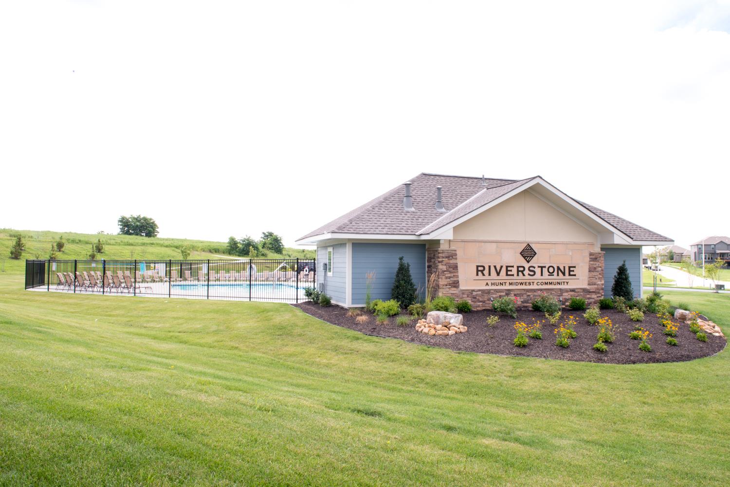 The Reserve at Riverstone new home community entry monument and swimming pool in Park Hill school district