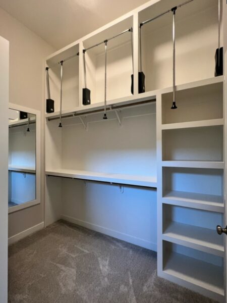 The Taft reverse 1.5-story floor plan master bedroom walk-in closet with three-season storage.