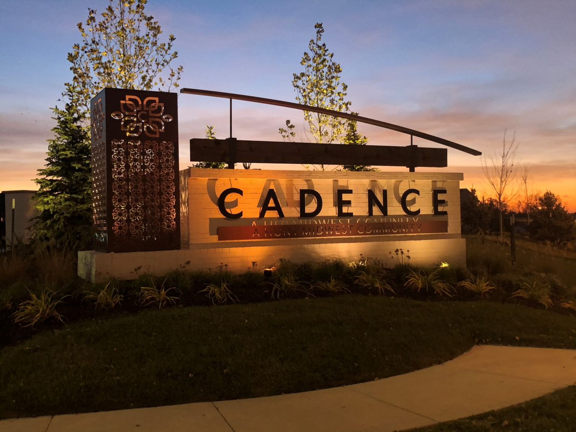 Cadence new home community entry monument night Kansas City