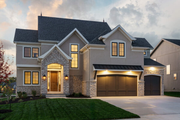The Kennedy two-story floor plan French Country elevation by Patriot Homes.